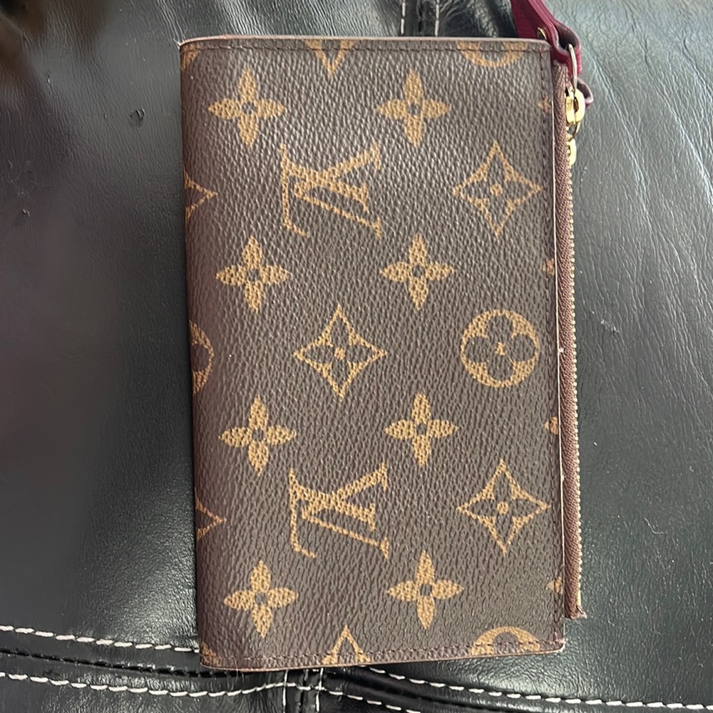 Gently used Louis Vuitton Monogram Snap closure wallet.